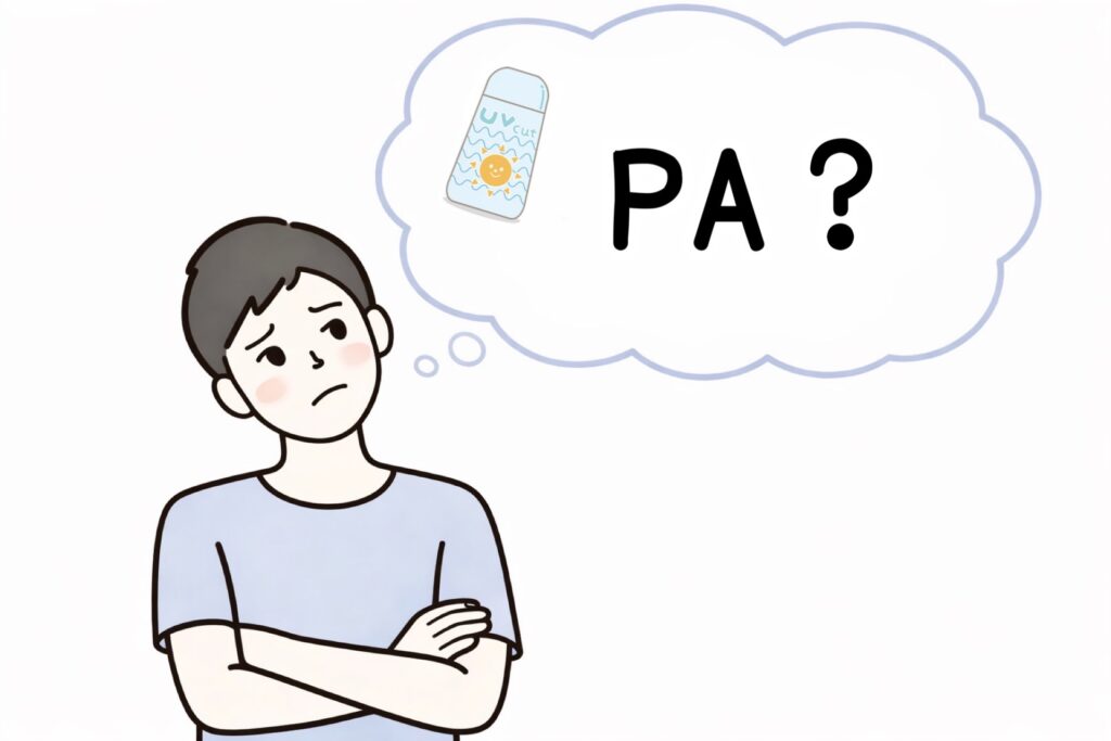 日焼け止めに表示されている「PA」について考えている男性の画像