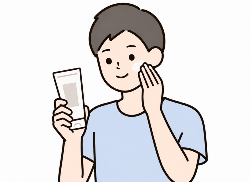 メンズ向けオールインワンを顔に塗っている男性の画像